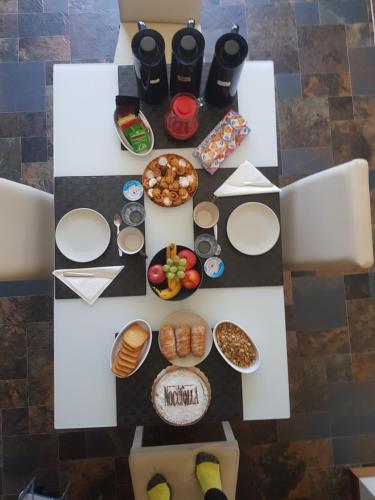 an overhead view of a table with food and snacks at La Morona in Rocchetta Tanaro