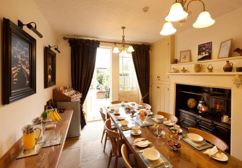 a dining room with a long table and chairs at The Villa in Robin Hoods Bay in Robin Hood's Bay