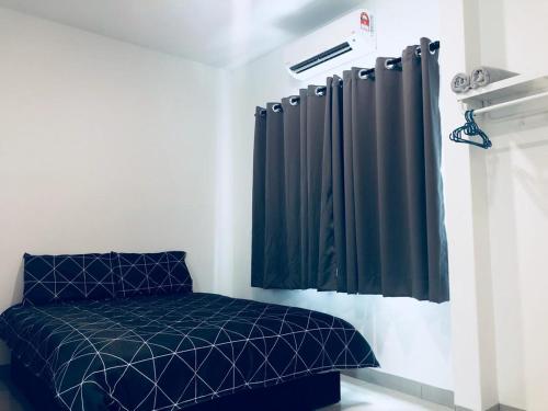 a bedroom with a blue bed and black curtains at LunaStay (Shared Common Area) in Lunas