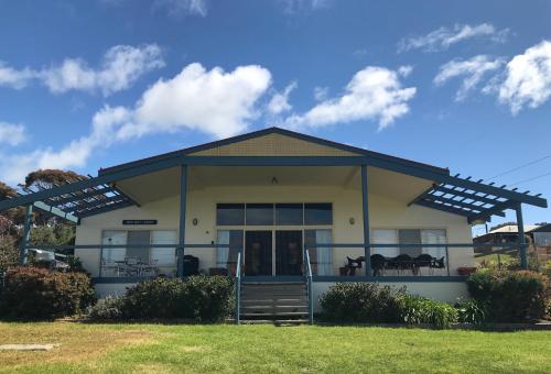 a house with a pergola on top of it at Emu Bay Lodge in Emu Bay