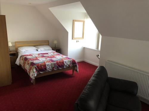 A bed or beds in a room at Balmoral Hotel 