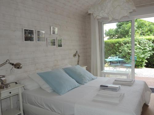Katil atau katil-katil dalam bilik di Chambres d'hôtes Villa Surcouf