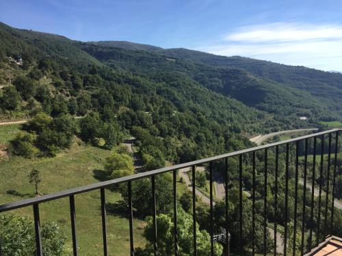 a view from a balcony of a valley with trees at La Fusteria del Casat in Sarroca de Bellera