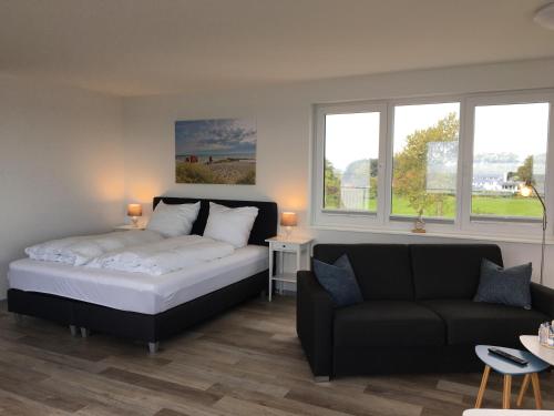 Una cama o camas en una habitación de Strandappartements Haus Strandkieker
