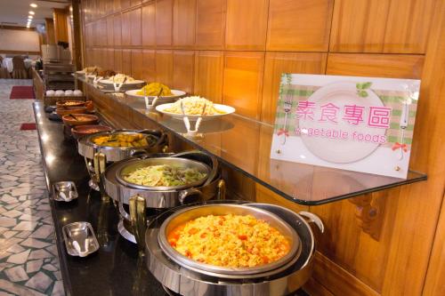 a buffet line with many different types of food at Dong Tair Spa Hotel in Wenquan