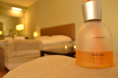a bottle of soap sitting on a table in a hotel room at Ellopia Point Hotel in Ioannina
