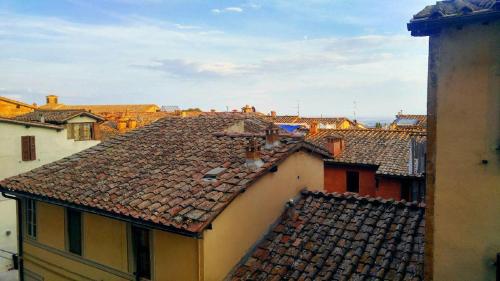 a view of roofs of buildings in a city at La Lilla in Siena