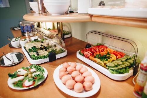 a table with three plates of food on it at Hotel "Helle Mitte" Berlin in Berlin