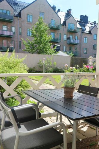 a picnic table and two chairs on a patio at Comfort Hotel Arctic in Luleå