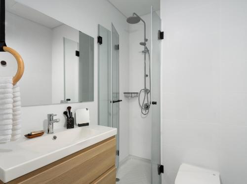 a bathroom with a sink and a shower at Mr. Ben Yehuda - By TLV2GO in Tel Aviv