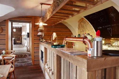 a kitchen with a wooden counter with a sink at Vltavská pohádka in Český Krumlov
