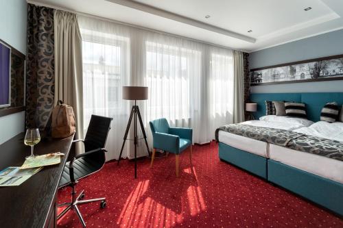Postel nebo postele na pokoji v ubytování Hotel Na Vývoji