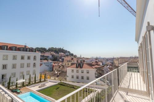 a view of the city from the balcony of a building at Prime Lisbon - Mouraria in Lisbon