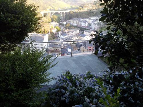 a view of a city with a bridge in the background at Casona El Gurugu in Luarca