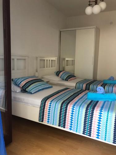 Postel nebo postele na pokoji v ubytování Apartmani Eta