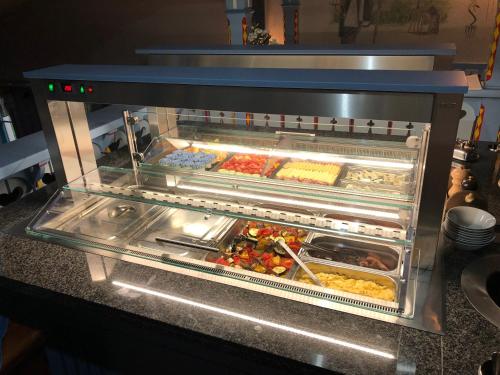 an oven filled with many different types of food at Hotel Na Dolině in Frenštát pod Radhoštěm