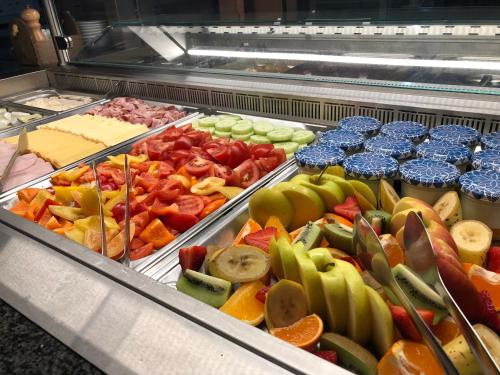 a buffet filled with different types of fruits and vegetables at Hotel Na Dolině in Frenštát pod Radhoštěm