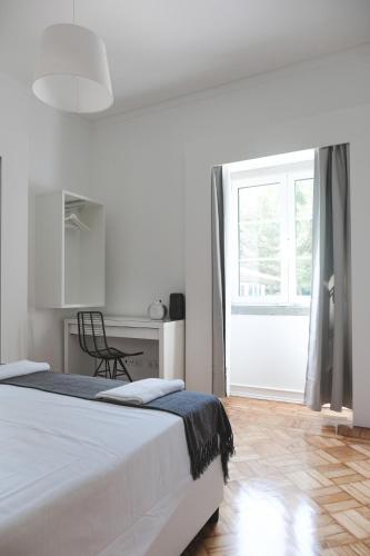 Ένα ή περισσότερα κρεβάτια σε δωμάτιο στο 4U Lisbon Airport Suites