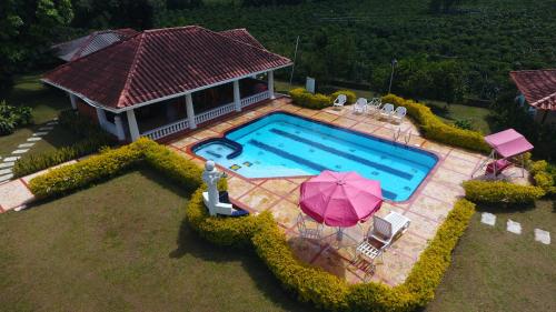 an overhead view of a swimming pool with a house at Hotel La Coqueta in Montenegro