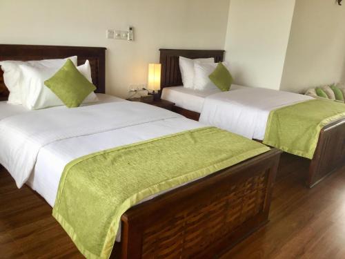 Postel nebo postele na pokoji v ubytování Avonil Resort Yala