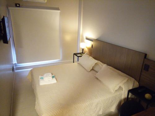 Cama o camas de una habitación en Apart Hotel Comra