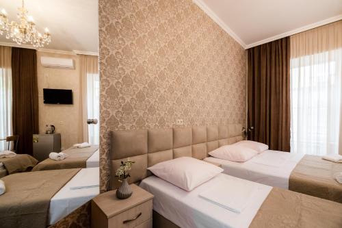 Postel nebo postele na pokoji v ubytování Star Hotel