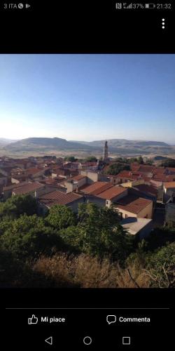 a view of a city with buildings and a town at La casa delle fate in Giave