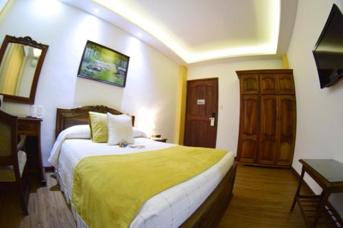 Cama o camas de una habitación en El Gran Hotel de Pereira