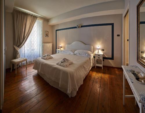 Кровать или кровати в номере Antico Palazzo
