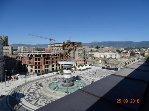 a view of a city with a fountain in the middle at Square Vanilla Apartments in Skopje