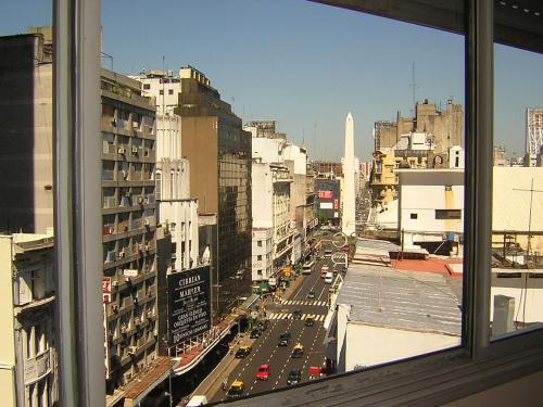 a view of a busy city street from a window at Corrientes y Esmeralda in Buenos Aires