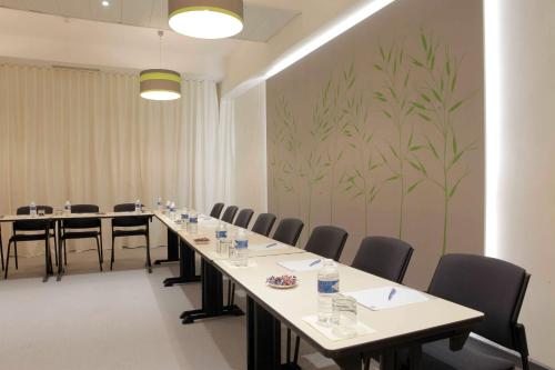 a conference room with a long table and chairs at Best Western Crequi Lyon Part Dieu in Lyon