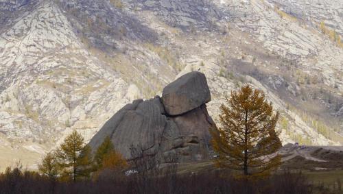 a large rock in front of a mountain at My Mongolia Eco Ger Camp in Nalayh