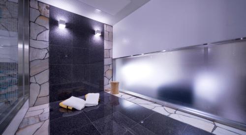 a bathroom with two white seats in a room at Hotel Glow Yokkaichi (Adult Only) in Yokkaichi