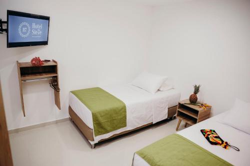 Posteľ alebo postele v izbe v ubytovaní Hotel Sie7e