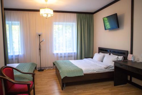 Кровать или кровати в номере Budget Hotel Victoriya
