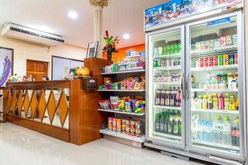 a store with a refrigerator filled with lots of drinks at PN Gold Resort in Bangsaen