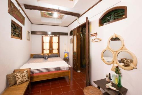 מיטה או מיטות בחדר ב-joglo Yudhistira