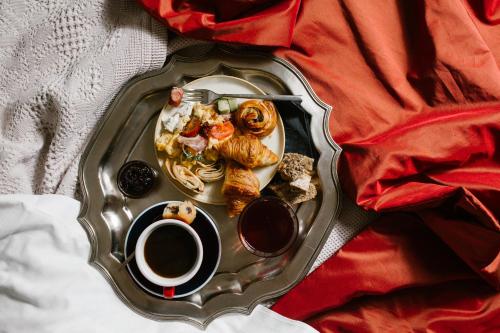 a tray with a plate of food and a cup of coffee at A for Athens in Athens