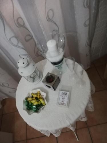 a small table with a white table cloth and a plate of food at b&b ERCOLANO Scavi in Ercolano