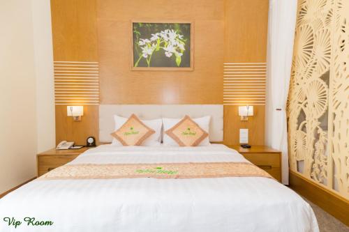 Ένα ή περισσότερα κρεβάτια σε δωμάτιο στο Palm Hotel Thanh Hoa