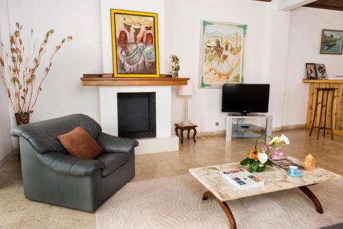 a living room with a couch and a coffee table at Somptua Garden in Ivato