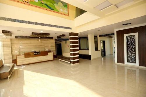 a large room with a lobby with a couch at Rock Star Hotel in Pushkar