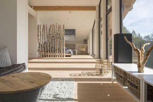 a hallway of a house with a table and chairs at Schweizerhaus in Alpirsbach