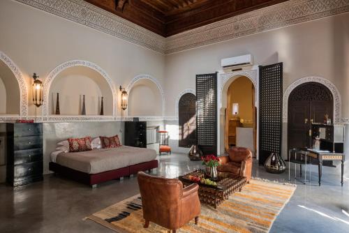 a living room with a bed and a table at 72 Hotel & Spa in Marrakech