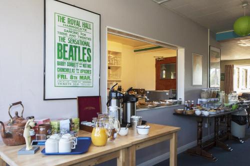 a kitchen with a counter with some food on it at YHA Hawes in Hawes