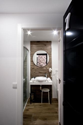 a bathroom with a sink and a mirror at Soléa House Hotel Boutique in Benicàssim