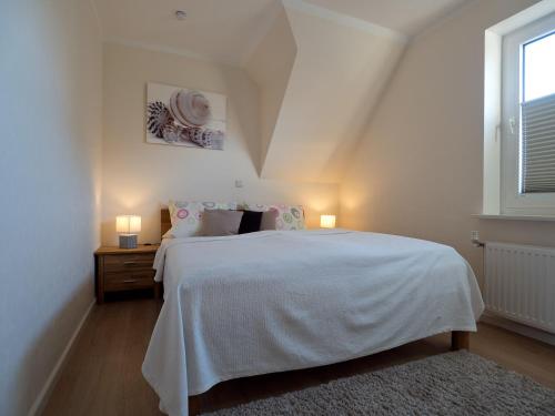 Postel nebo postele na pokoji v ubytování Appartement Lehnsweg 8, Büsum