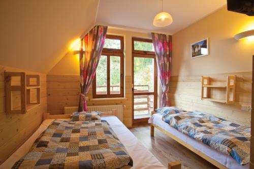 Кровать или кровати в номере Schronisko PTTK Orlica