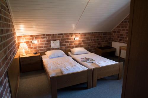 Postel nebo postele na pokoji v ubytování Hotel de Lindeboom